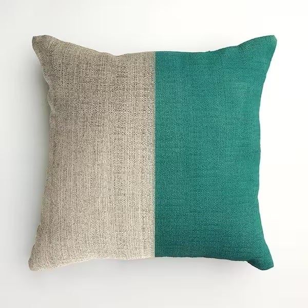 A pillow with one half freshly spray-painted, giving it a brand-new look.