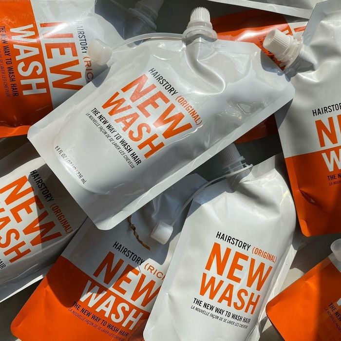 A pile of squeeze bags filled with hair products.