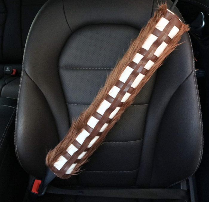 A seat belt in a car with a Chewbacca seat belt cover