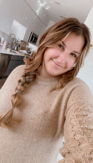 Ali Faccenda showing off her extensions in a side braid.