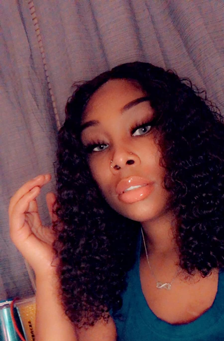 A reviewer shares a Snapchat selfie showcasing their curly hair.