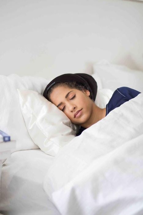 A model is pictured wearing the Slap and enjoying a peaceful sleep.