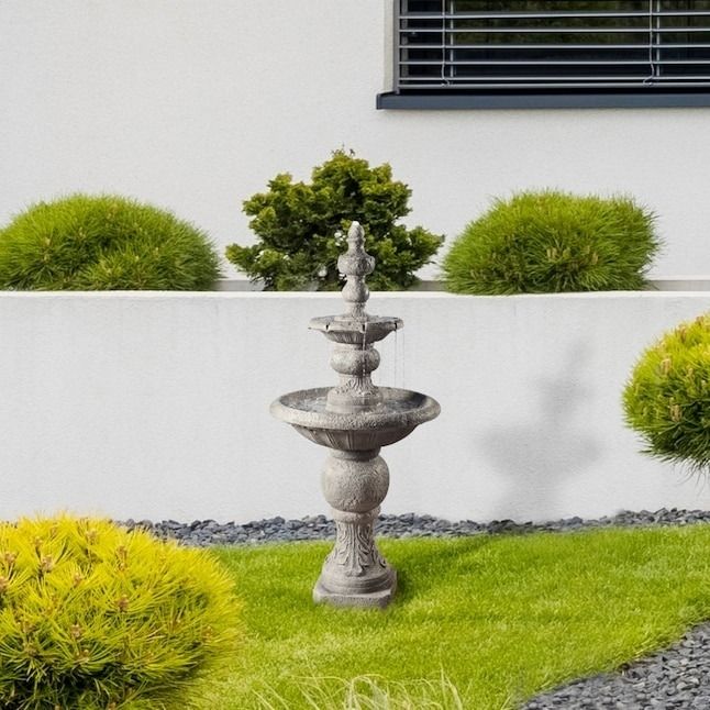 the tiered fountain enhancing a garden setting