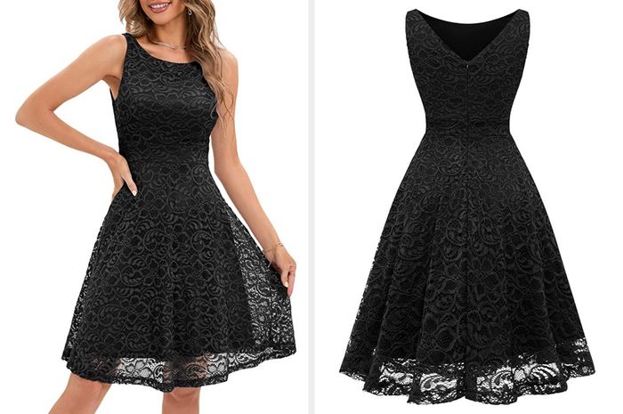 A model wearing a short, high-neck black lace dress with an asymmetrical skirt, showing the back of the product featuring a subtle V-neckline against a white background.