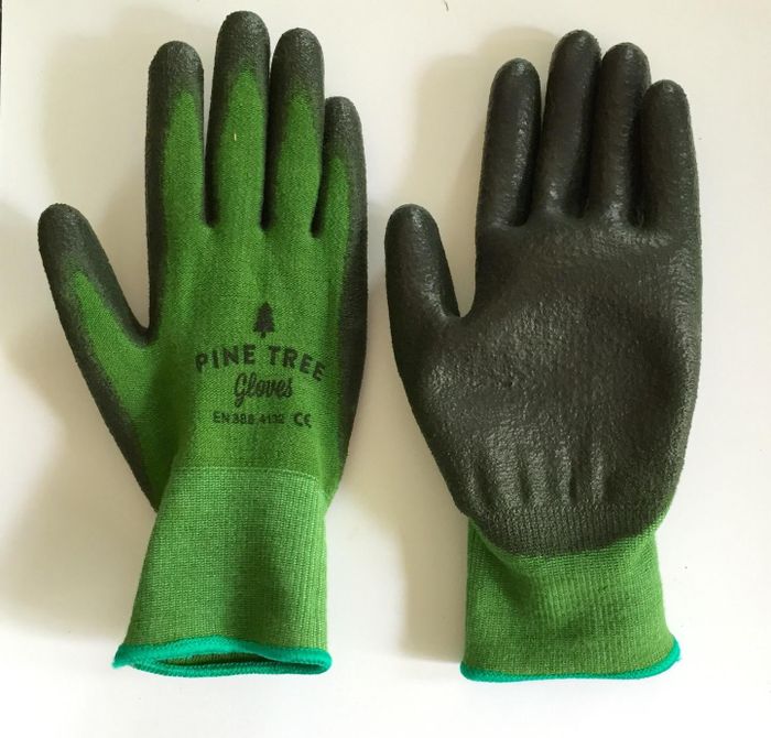Green garden gloves made from bamboo material.