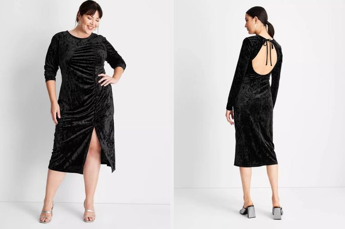Model showcasing a black velvet long sleeve midi dress with front ruching and a small slit, paired with silver open-toed heels. The model is also shown in a rear view, highlighting the open back and tie detail at the top, styled with silver block heels.