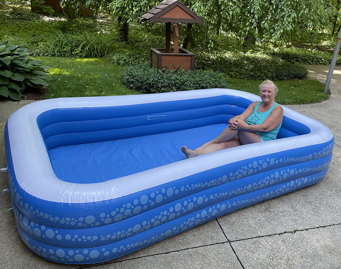 A reviewer enjoying a moment in the inflatable pool