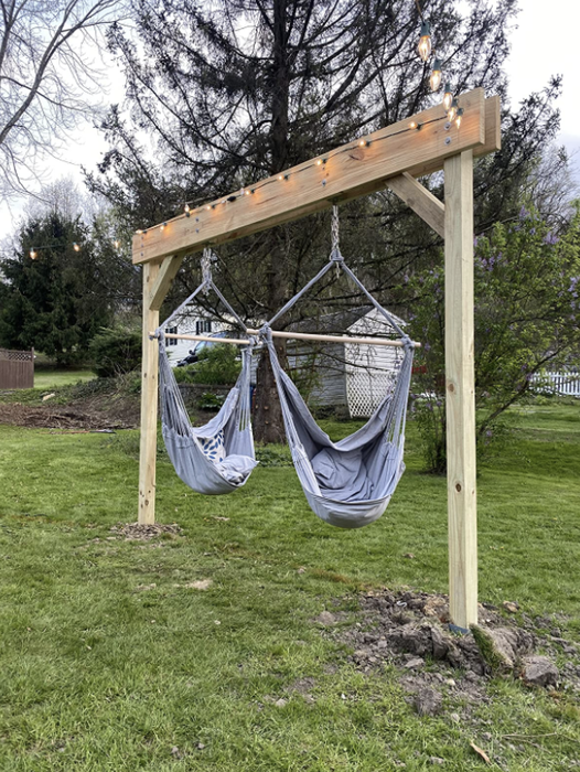 Two blue hammocks placed in the reviewer’s backyard, offering a perfect spot for relaxation.