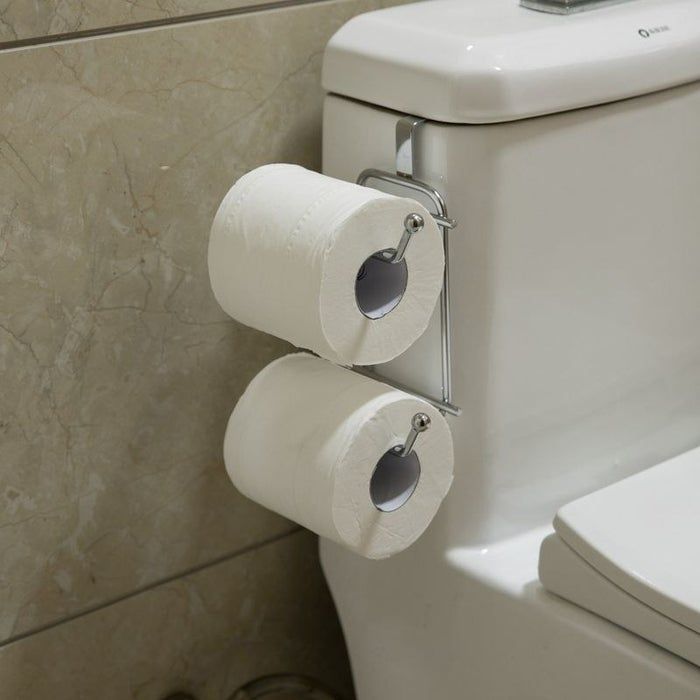 Two toilet paper rolls neatly stored on a toilet paper holder placed beside the toilet.