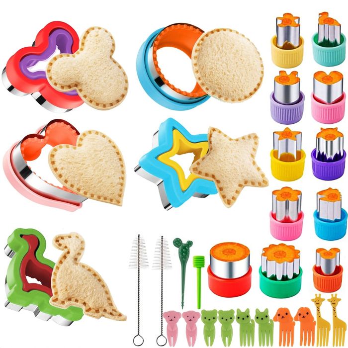 A variety of sandwich cutters, vegetable cutters, food picks, and cleaning brushes designed to make lunch preparation creative and enjoyable