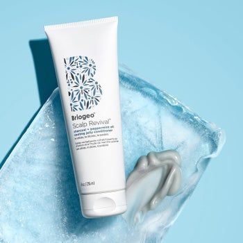 Bottle of conditioner elegantly displayed on an ice block