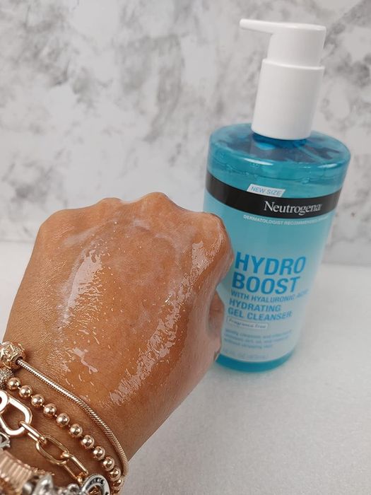 Reviewer showing the face wash swatched on the back of their hand
