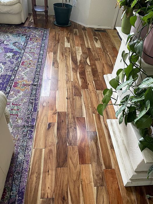 A reviewer's pristine, gleaming wood floor after using the mop
