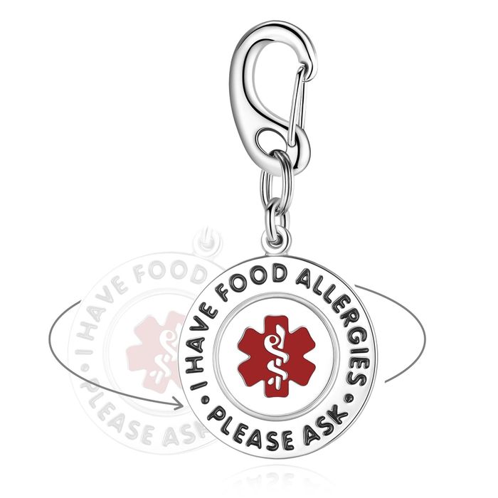 A silver keychain featuring the message 