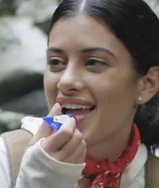 A gif of a model applying the balm to their lips