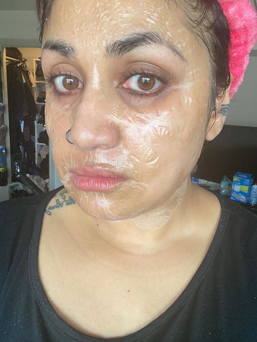reviewer with a face mask applied