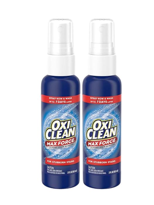 Two bottles of OxiClean Max Force Laundry Stain Remover, each equipped with a trigger spray, specifically formulated for tackling tough stains. Each bottle contains 2 fl oz