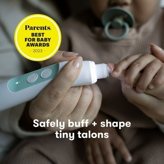 An adult uses an electric baby nail buffer on an infant's nails, named 'Parents Best for Baby 2023'.