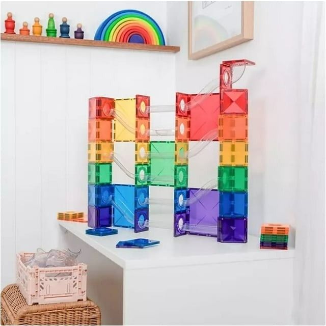 A vibrant magnetic tile construction set displayed on a white shelf, highlighting a fun and creative design. Perfect for educational play.