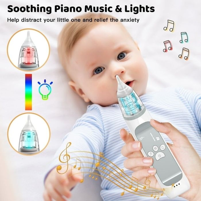 A baby and a nasal aspirator