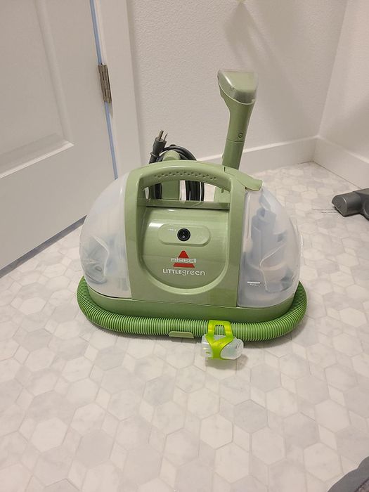 a reviewer's image showing the green portable cleaner in action