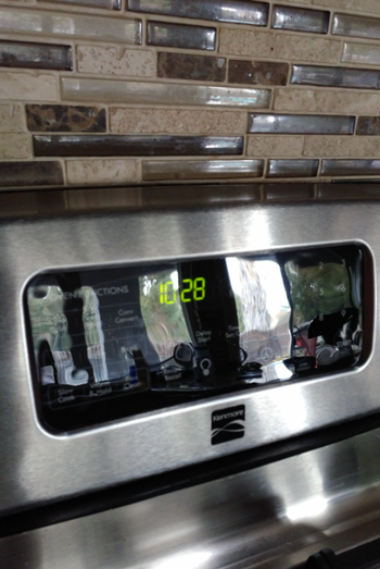 The same oven top, now wiped clean and free of stains