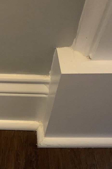 The same reviewer demonstrating their spotless baseboards after a swift swipe with the tool