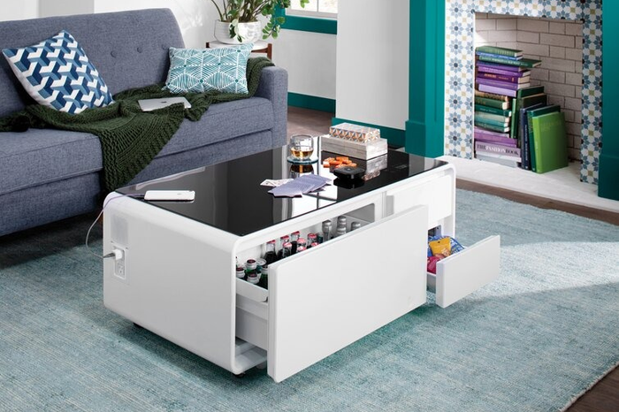 The coffee table with its front drawers wide open.