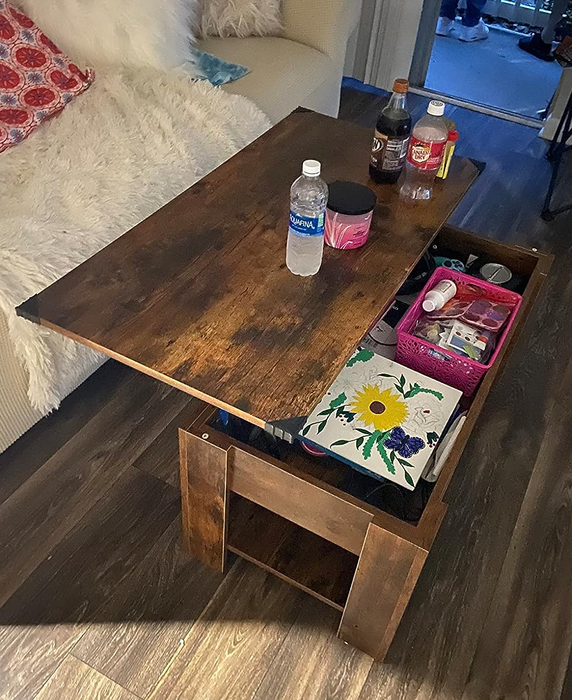 A customer's photo of the brown coffee table with its top raised
