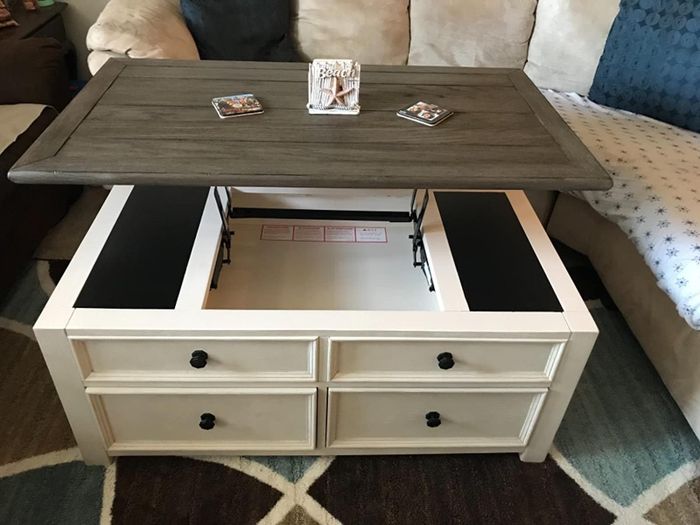 A photo from a reviewer displaying the lift-top storage feature.