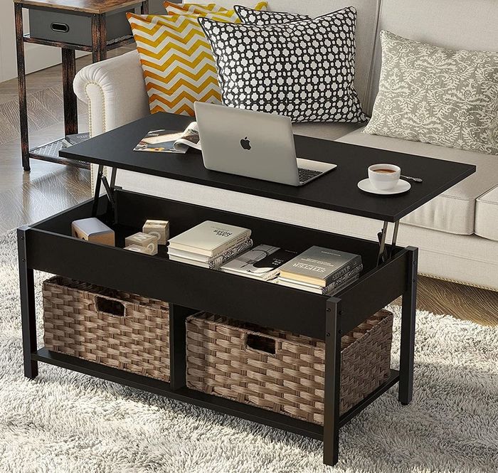 A stylish black coffee table with a lift-up top, revealing a hidden storage compartment for extra space.