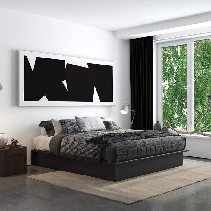 The black DHP Maven Platform Bed with Upholstered Faux Leather