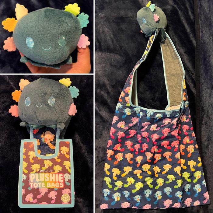A plushie tote bag featuring a smiling character design and colorful accents, showcased against a dark backdrop. The package reads