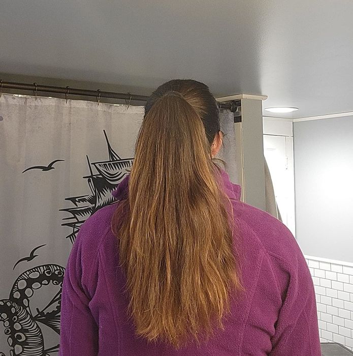 Reviewer showing the results after using the Wonder Water treatment.