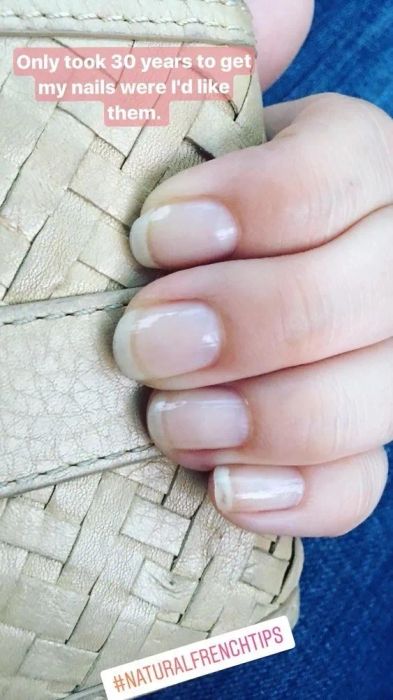 A reviewer’s photo of their strong nails with the caption, 