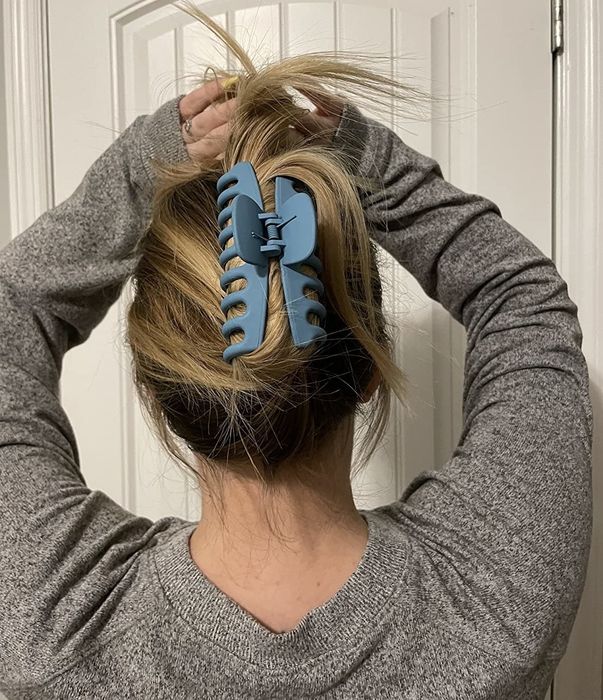 The back view of the reviewer, showing her hair styled with a blue claw clip.