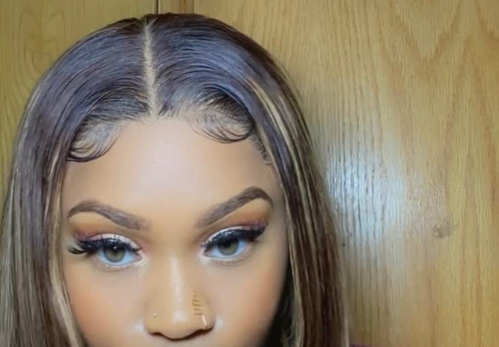 A close-up view of a wig that’s been glued down by the reviewer.