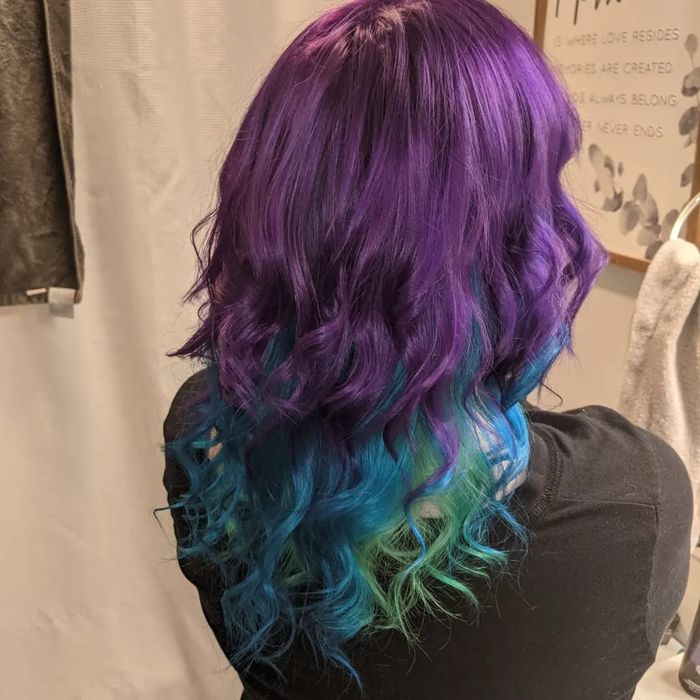 reviewers showing off their purple, blue, and green hair after using the dye