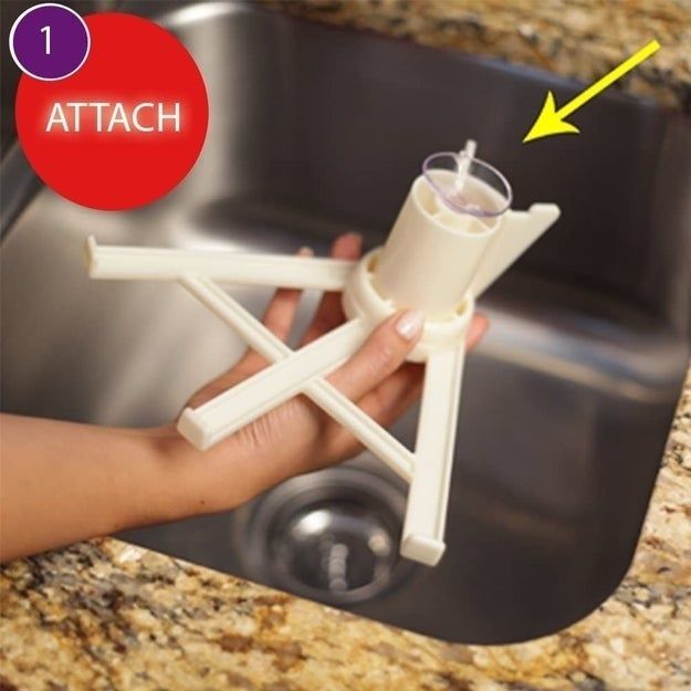 A person holding a white, tripod-like kitchen tool over a sink, with instructions saying 