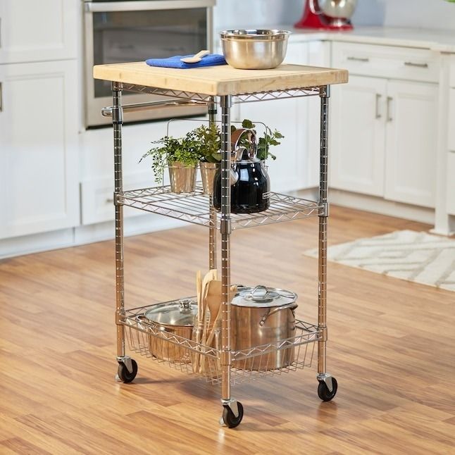 A rolling kitchen cart featuring a wooden block top and wire shelving on the bottom, perfect for additional kitchen storage.