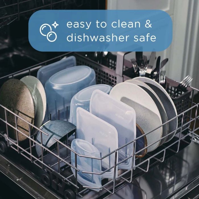 Plates, bowls, and reusable food storage bags are neatly arranged in a dishwasher with text overlay: