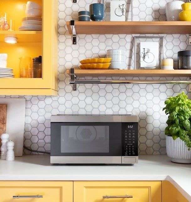 The microwave sitting on a kitchen counter