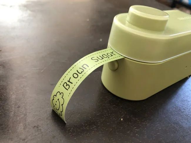 A label printing out of a label printer.