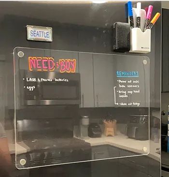 A board mounted horizontally on a fridge.