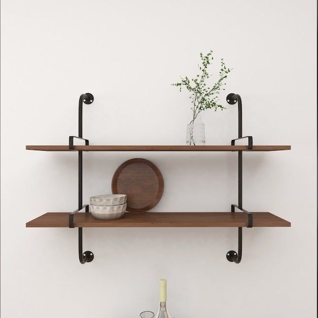 The floating shelves supported by brackets, mounted on a wall