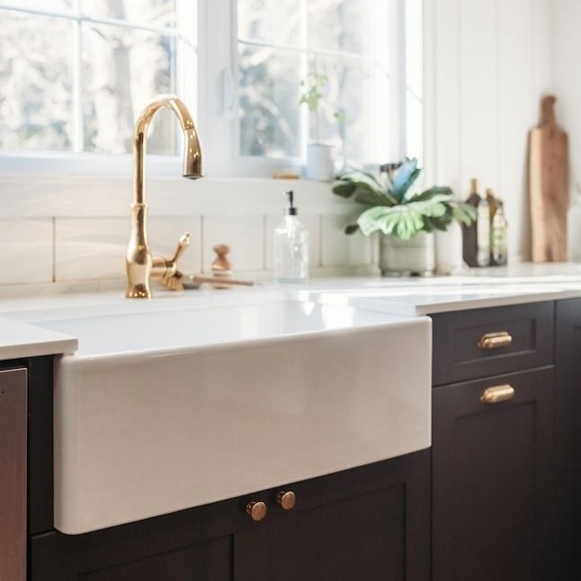 A spacious and deep farmhouse sink, perfect for larger dishes and heavy-duty cleaning tasks.
