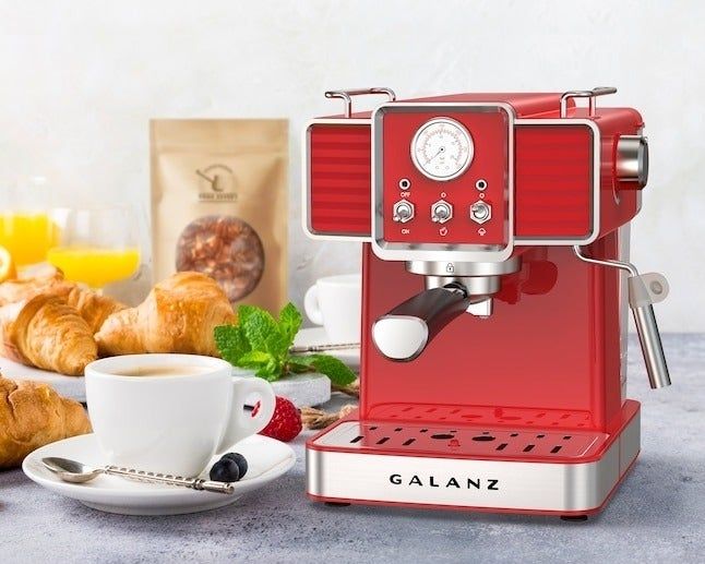 A Red Galanz espresso machine with a vintage flair, displayed on a breakfast table with coffee, croissants, and fresh fruit. The caption reads: 