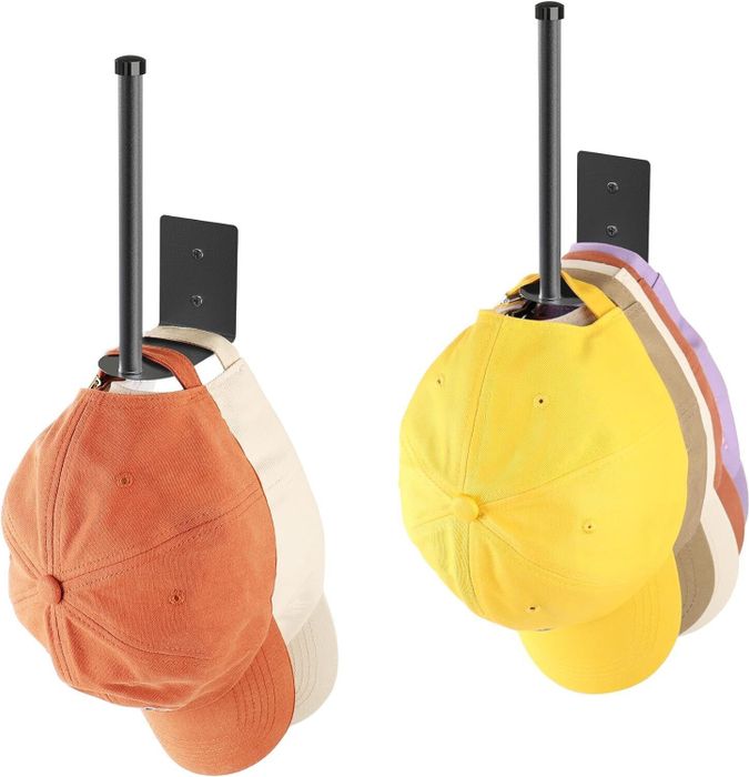 Two hooks designed for hanging baseball caps, with colorful hats displayed on them