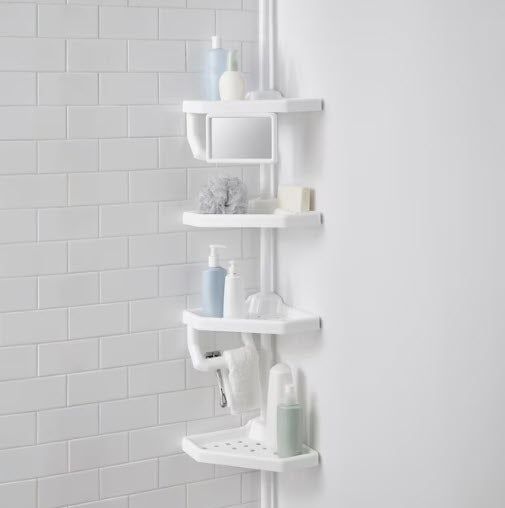 A white corner shower rack with five shelves, holding a variety of bathroom essentials such as soap, sponges, bottles, and more, all neatly arranged for easy access.