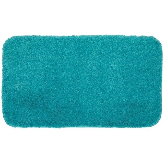 A rectangular plush bath mat shown from above, highlighted in an article focused on home goods shopping.